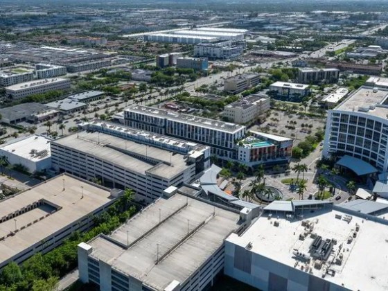Aerial view of a modern urban area with multiple buildings and streets.